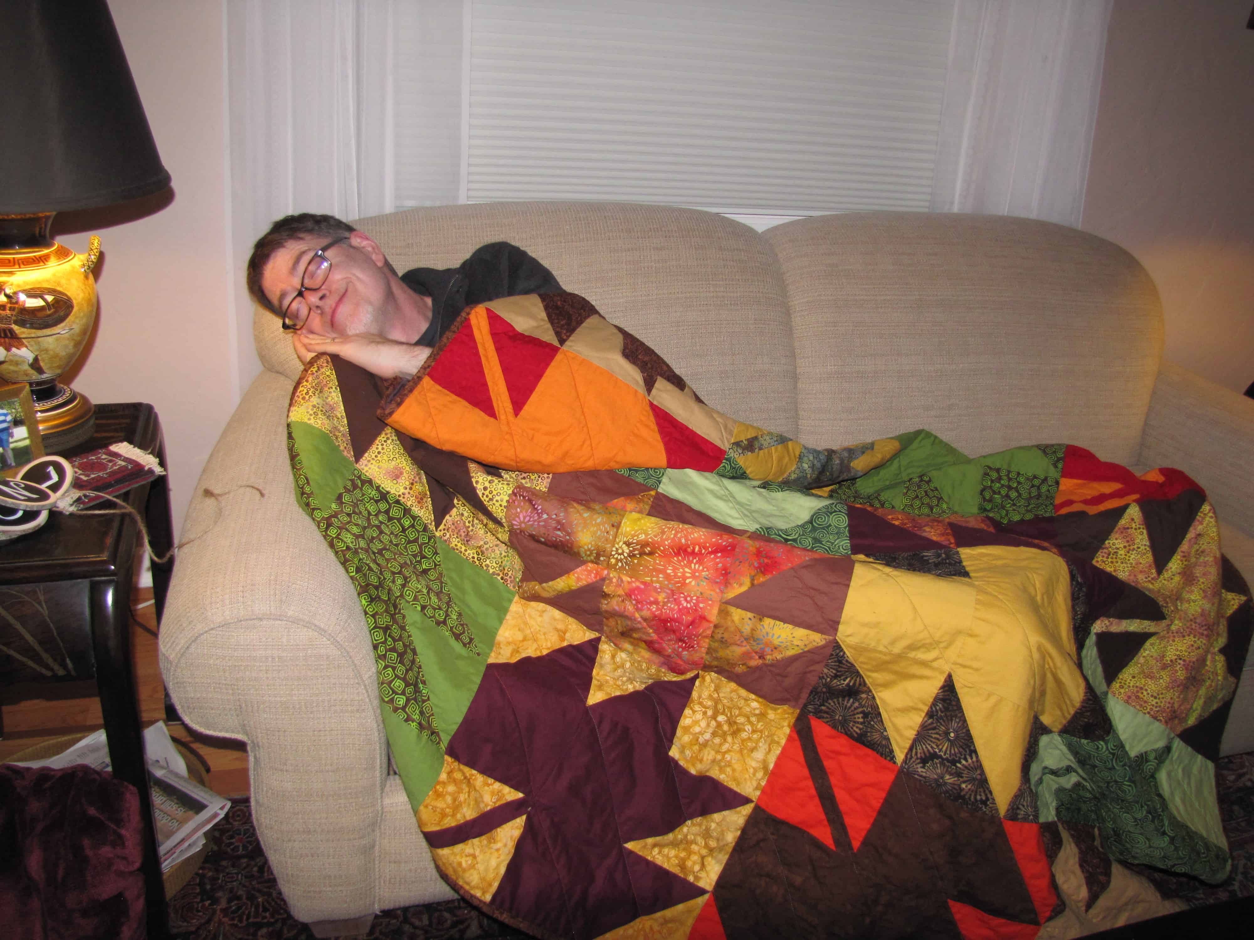 My brother, Mark, sleeping happily under his new quilt.